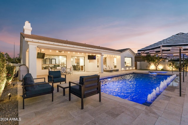 view of pool featuring pool water feature, an outdoor hangout area, an in ground hot tub, and a patio area