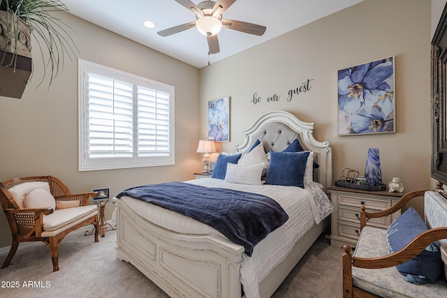 carpeted bedroom featuring ceiling fan