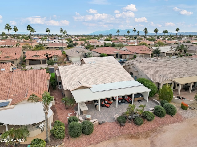 birds eye view of property with a mountain view