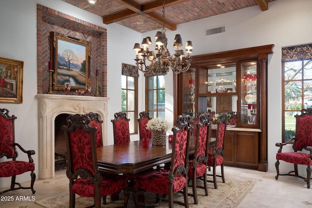 dining area with brick ceiling, beamed ceiling, and a wealth of natural light