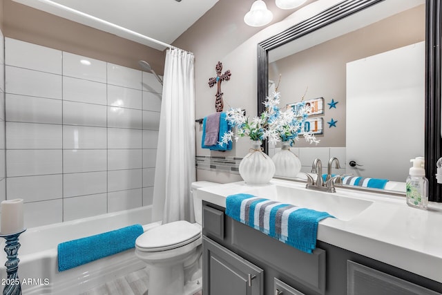 bathroom with toilet, shower / tub combo with curtain, and vanity