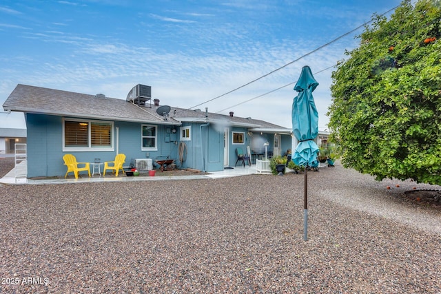 9928 W Hope Cir N, Sun City, AZ 85351 - back of house featuring a patio, central AC unit, and concrete block siding
