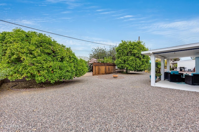 9928 W Hope Cir N, Sun City, AZ 85351 - view of yard featuring a patio area and an outdoor living space