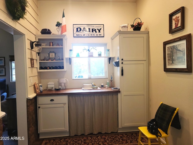 bar with white cabinetry