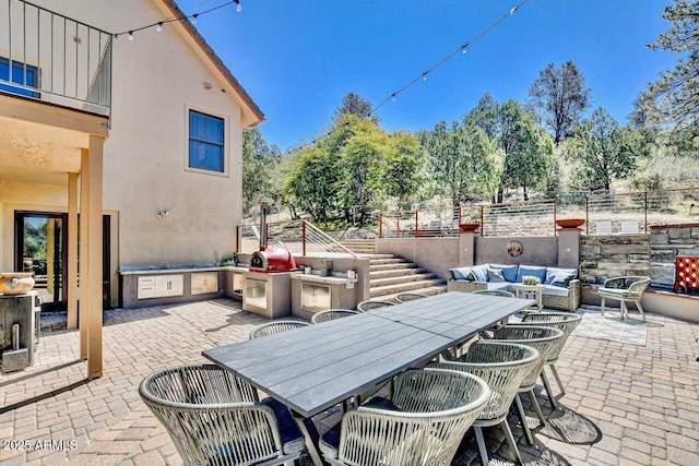 view of patio / terrace with area for grilling and an outdoor hangout area