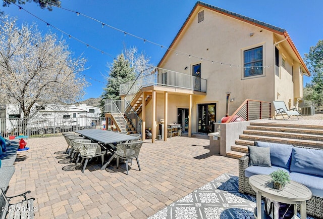 view of patio with a balcony and an outdoor hangout area