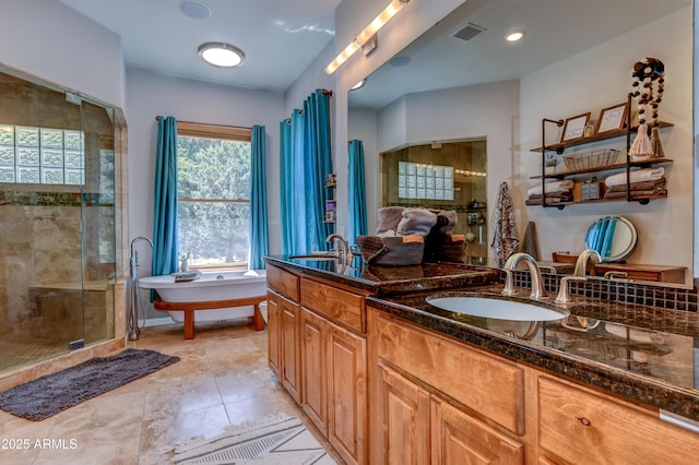 bathroom featuring plus walk in shower and vanity