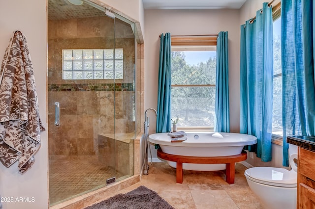 bathroom featuring plus walk in shower and toilet