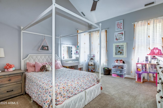 carpeted bedroom with ceiling fan and vaulted ceiling