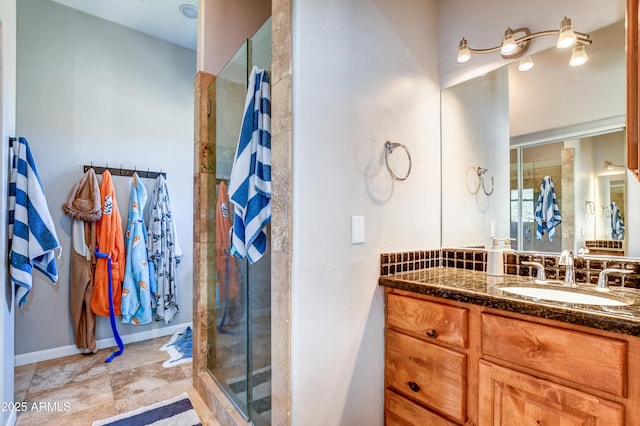 bathroom with walk in shower and vanity