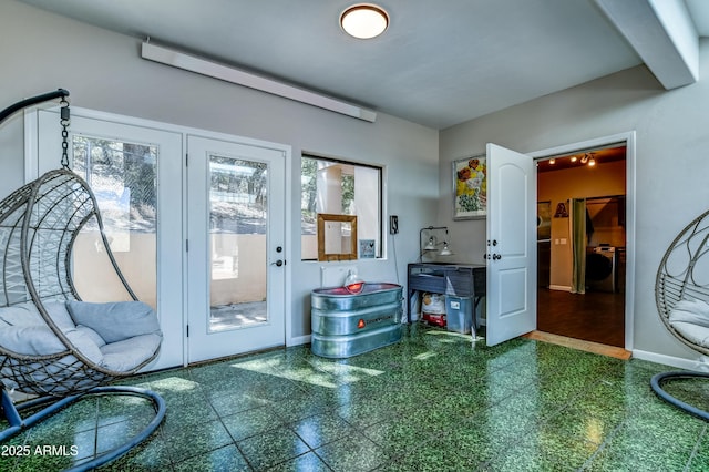 entryway featuring washer / dryer