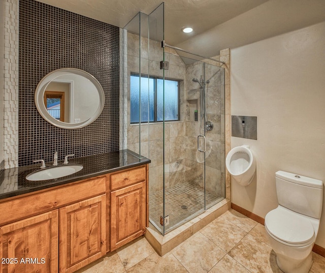 bathroom featuring toilet, an enclosed shower, vanity, and tile patterned flooring