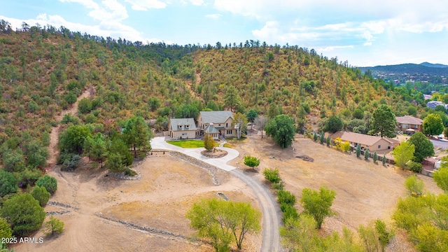 birds eye view of property with a mountain view