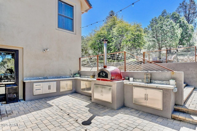 view of patio / terrace featuring an outdoor kitchen and area for grilling