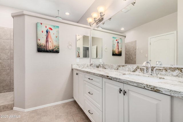 bathroom featuring tile patterned flooring and vanity