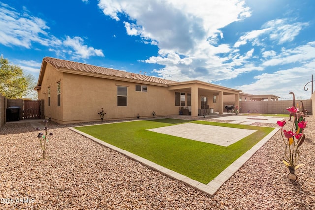 rear view of house with a patio