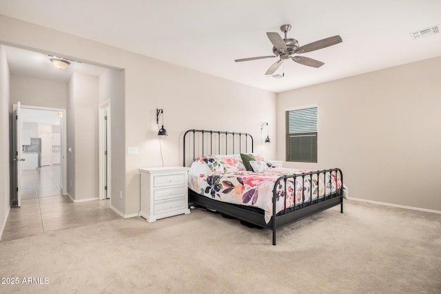 bedroom featuring ceiling fan and light carpet