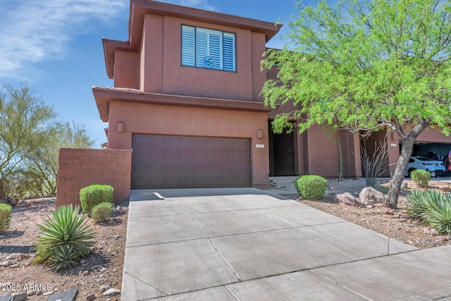 16255 E Ridgeline Dr, Fountain Hills, AZ 85268 - view of front facade featuring stucco siding, an attached garage, and driveway
