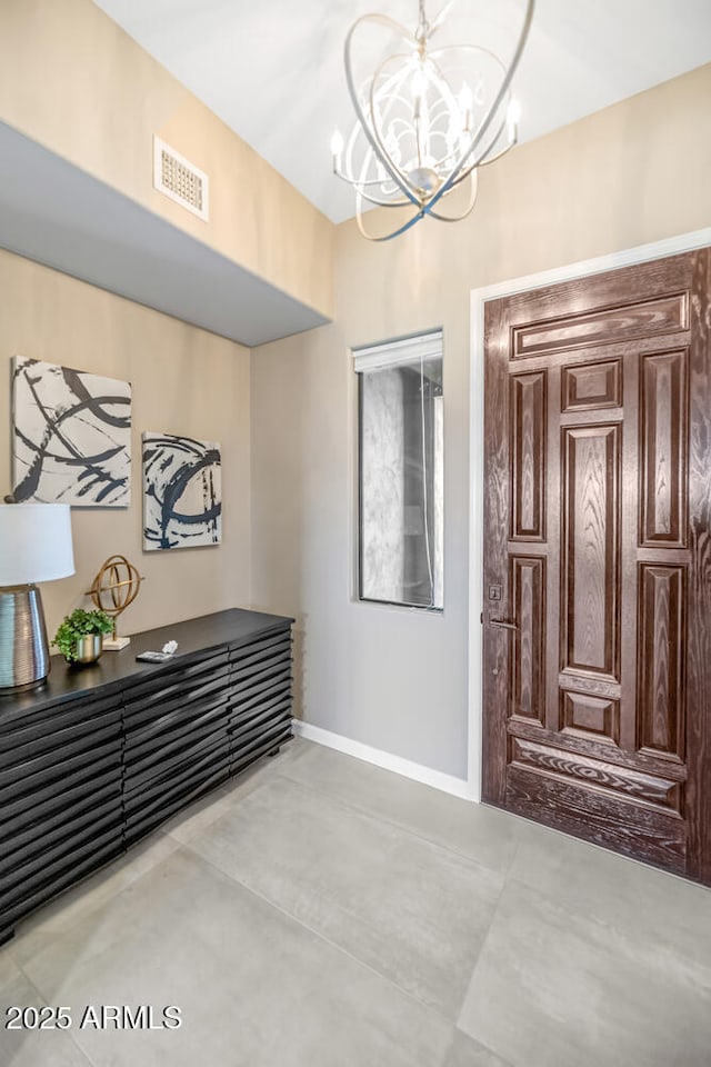 16255 E Ridgeline Dr, Fountain Hills, AZ 85268 - entryway with baseboards, concrete floors, visible vents, and a chandelier