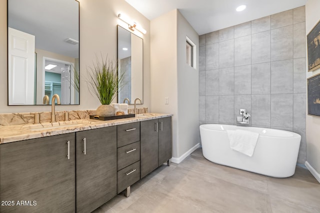 16255 E Ridgeline Dr, Fountain Hills, AZ 85268 - bathroom with a freestanding bath, a sink, double vanity, and tile walls
