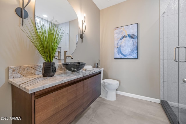 16255 E Ridgeline Dr, Fountain Hills, AZ 85268 - bathroom with a shower stall, baseboards, toilet, and vanity