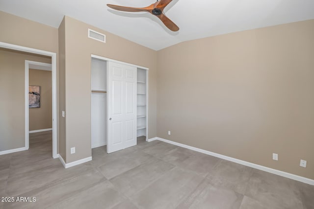 16255 E Ridgeline Dr, Fountain Hills, AZ 85268 - unfurnished bedroom with vaulted ceiling, baseboards, ceiling fan, visible vents, and a closet