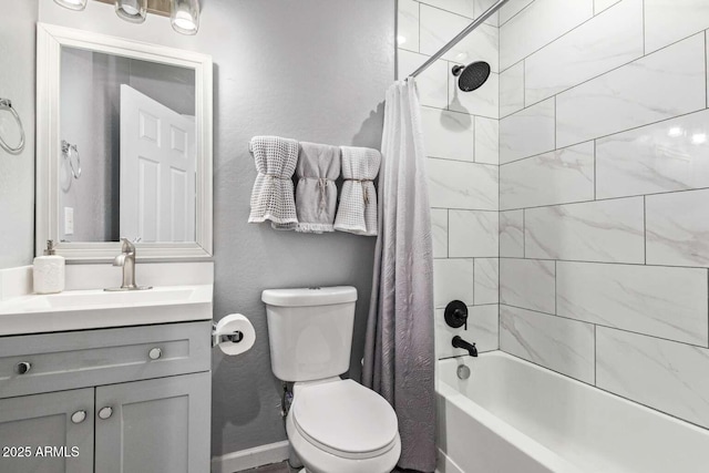 full bathroom with vanity, shower / bath combo, and toilet