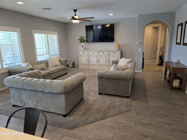2316 N Crestwood Dr, Florence, AZ 85132 - living room with visible vents, arched walkways, plenty of natural light, and ceiling fan