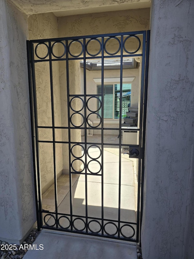 2316 N Crestwood Dr, Florence, AZ 85132 - details with a gate and stucco siding