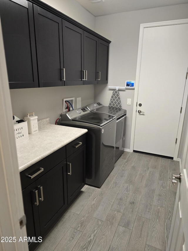 2316 N Crestwood Dr, Florence, AZ 85132 - clothes washing area with cabinet space, independent washer and dryer, and light wood-style floors