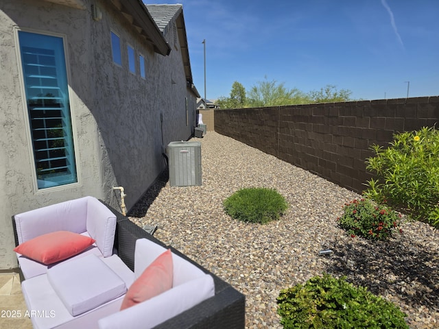2316 N Crestwood Dr, Florence, AZ 85132 - view of home's exterior with central AC, stucco siding, and fence