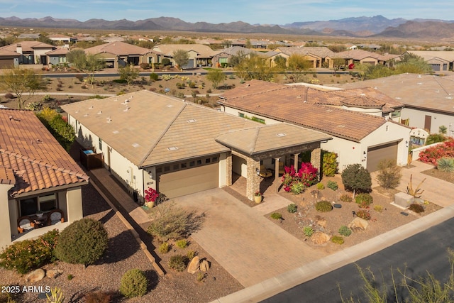 birds eye view of property with a mountain view