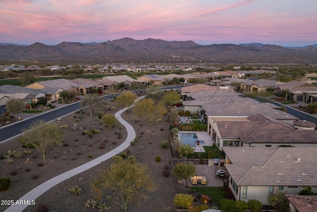 aerial view at dusk with a mountain view