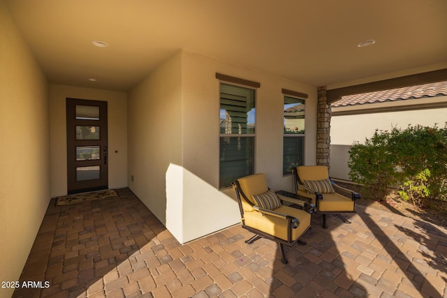 doorway to property featuring a patio area