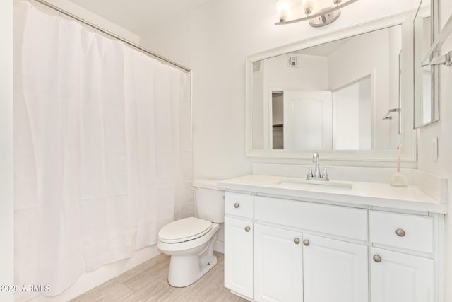 1701 E Colter St Unit 491, Phoenix, AZ 85016 - bathroom featuring toilet, vanity, and a shower with shower curtain