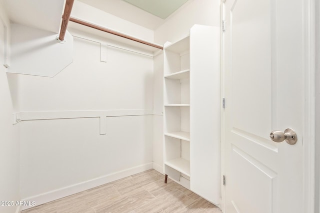 1701 E Colter St Unit 491, Phoenix, AZ 85016 - walk in closet with wood finished floors