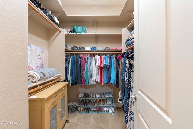 walk in closet featuring carpet floors