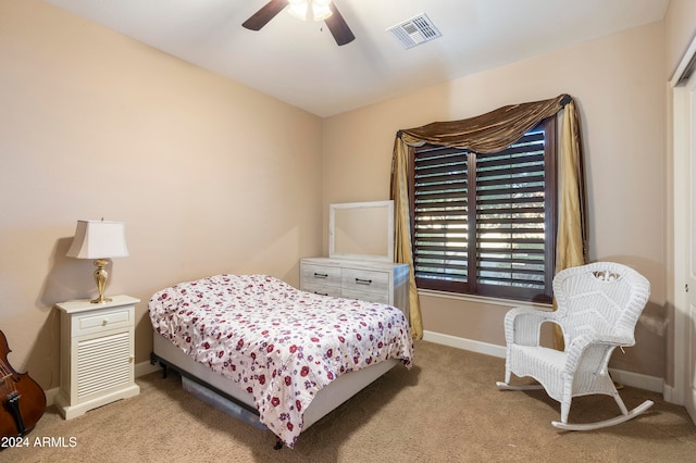 bedroom featuring light carpet and ceiling fan