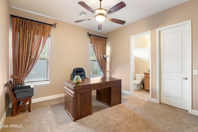 office with ceiling fan and light carpet