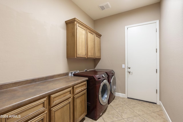 2378 N 158th Dr, Goodyear, AZ 85395 - laundry area featuring cabinet space, washer and dryer, light tile patterned floors, and baseboards