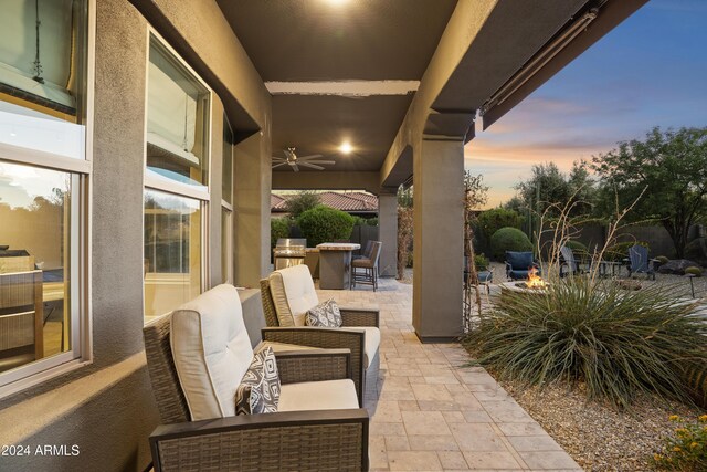 2378 N 158th Dr, Goodyear, AZ 85395 - view of patio / terrace featuring an outdoor fire pit and ceiling fan