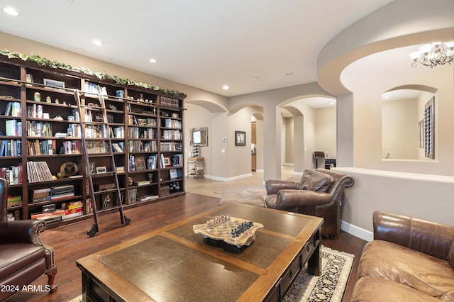 2378 N 158th Dr, Goodyear, AZ 85395 - living area with arched walkways, recessed lighting, wood finished floors, baseboards, and a chandelier