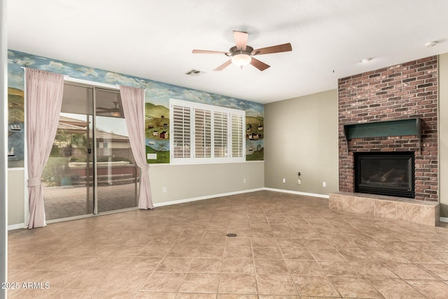 unfurnished living room with visible vents, baseboards, a brick fireplace, and ceiling fan