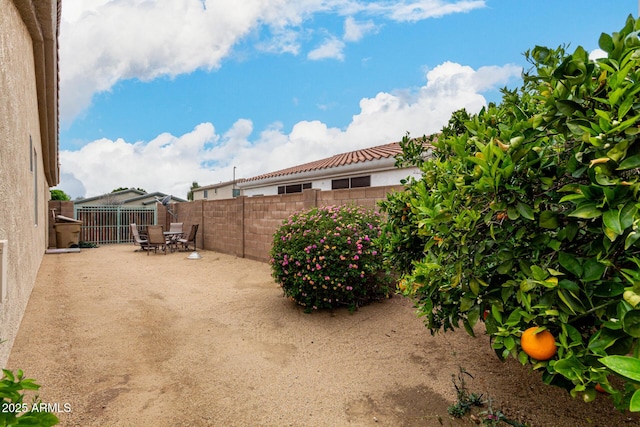 view of yard featuring a patio and a fenced backyard