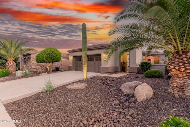 28878 N 127th Ln, Peoria, AZ 85383 - view of front of property with driveway, stucco siding, and an attached garage