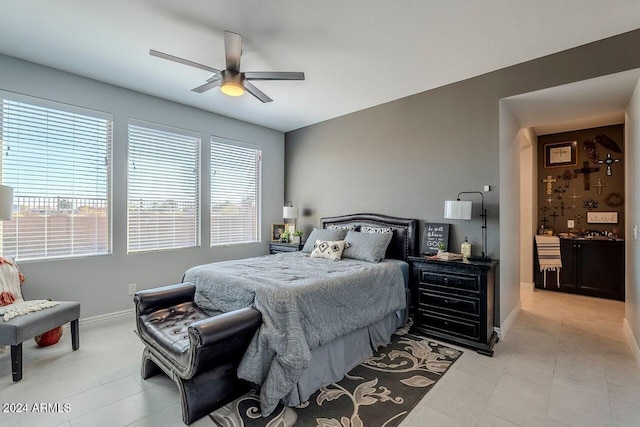 bedroom featuring ceiling fan and light tile patterned floors