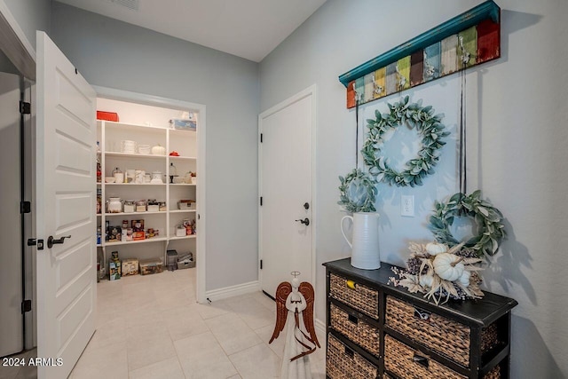 interior space featuring light tile patterned flooring