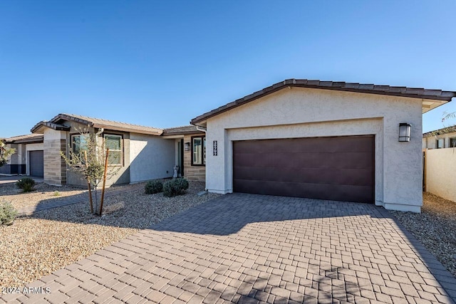 ranch-style home with a garage