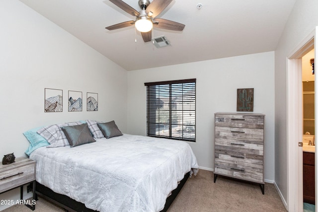 bedroom featuring ceiling fan, light colored carpet, visible vents, baseboards, and vaulted ceiling