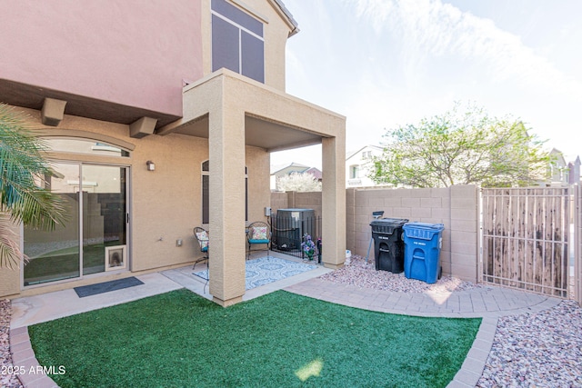 view of patio featuring fence and central AC unit